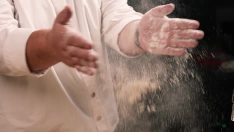 chef dusting flour