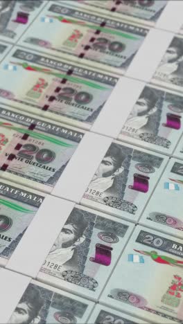 vertical video of 20 guatemalan quetzal banknotes printed by a money press