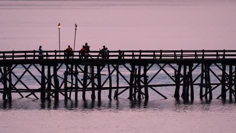 The-Mon-Bridge-is-an-old-wooden-bridge-located-in-Sangkla,-Thailand