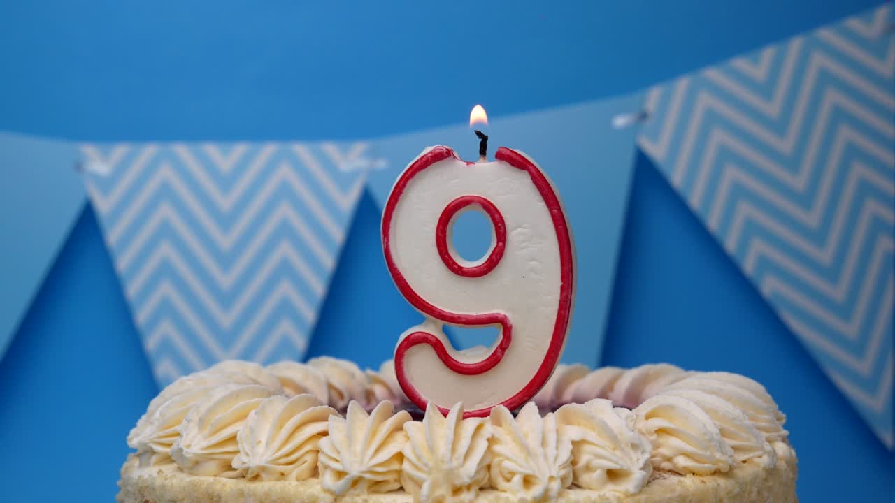 Happy birthday. 9 year old, cupcake, birthday cake with candles on a blue background.close-up