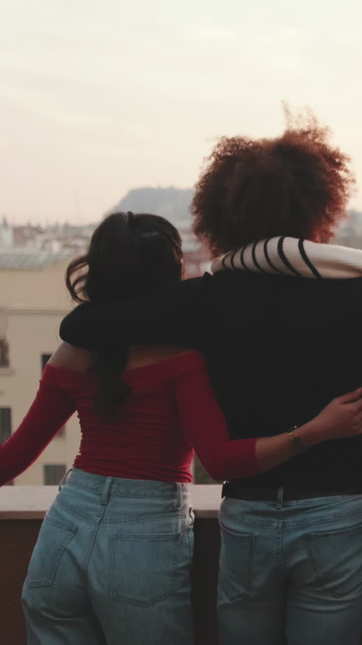 Friends Enjoying Rooftop View at Sunset
