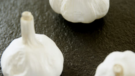 garlic on black background 4k