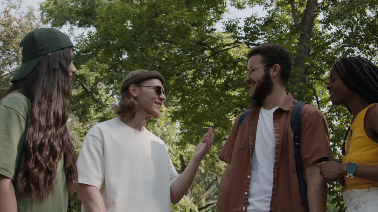 Diverse Group of Friends Talking and Laughing Outdoors