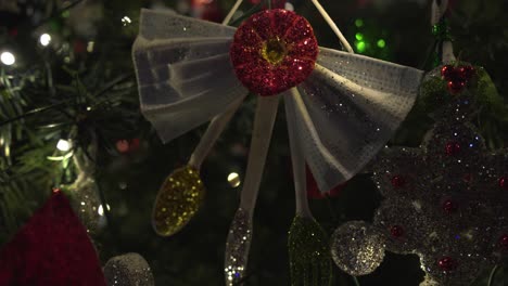 close-up shot of recycled christmas ornaments hanging on a christmas tree