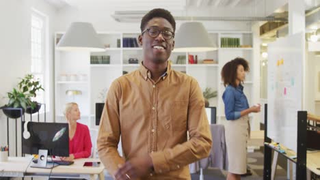 Business-man-smiling-at-the-camera