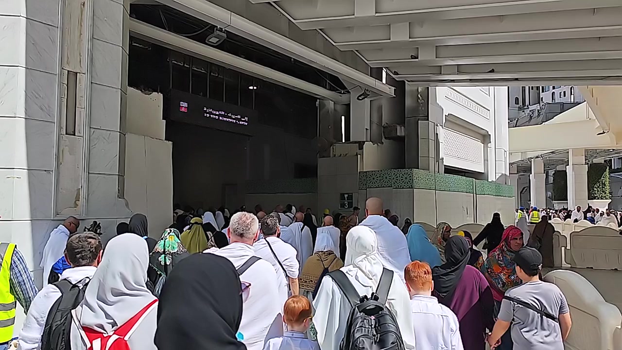 Pilgrims Walking Towards Entrance at Masjid al-Haram in Mecca