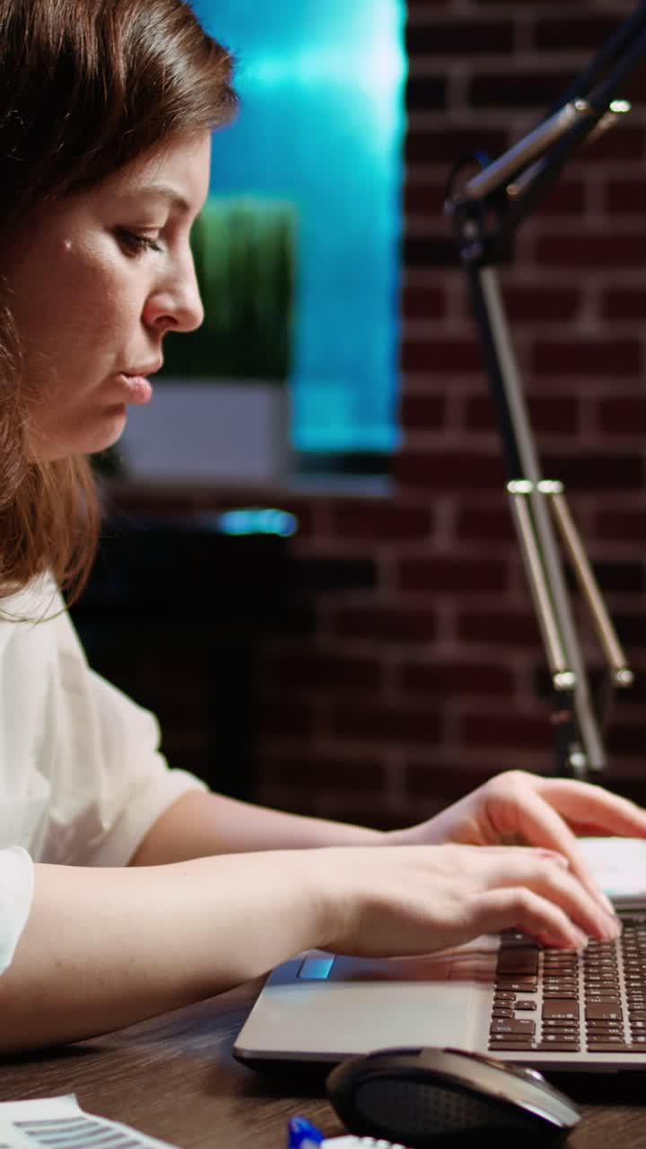 Vertical video Worker exasperated, putting head in head, frustrated by too much work in office