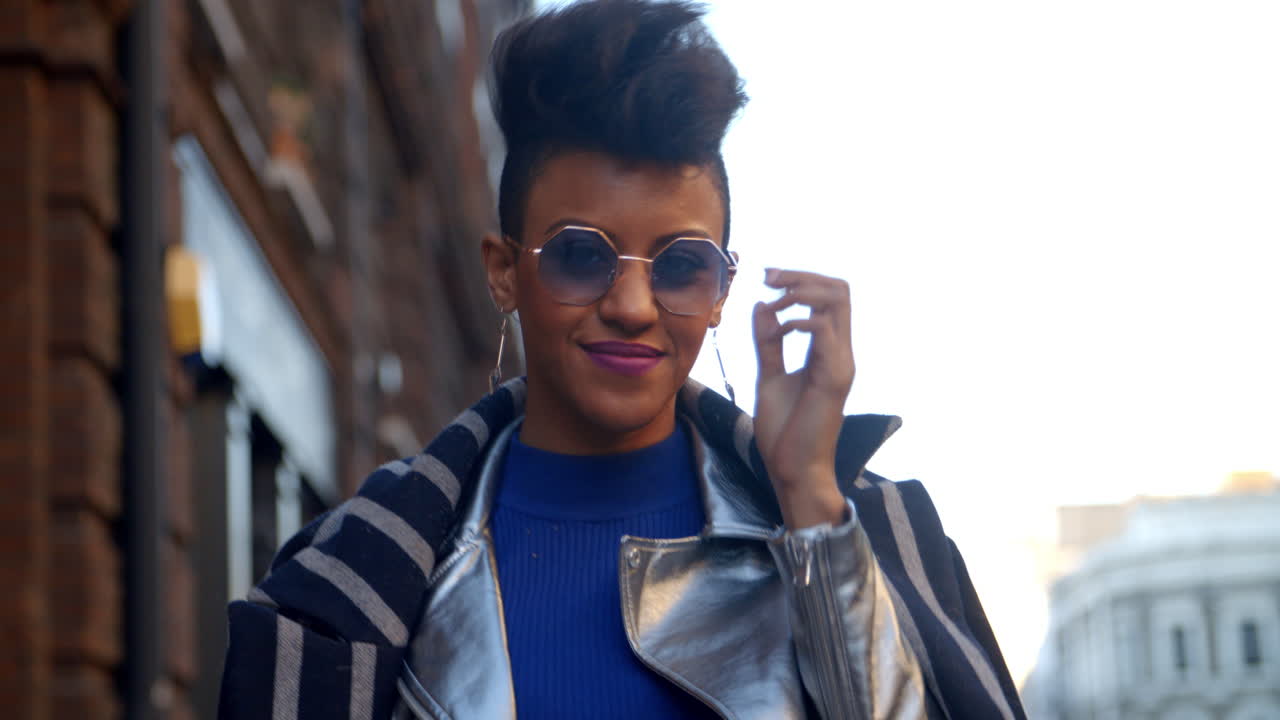 Stylish Fashion Blogger Walking Along Urban Street