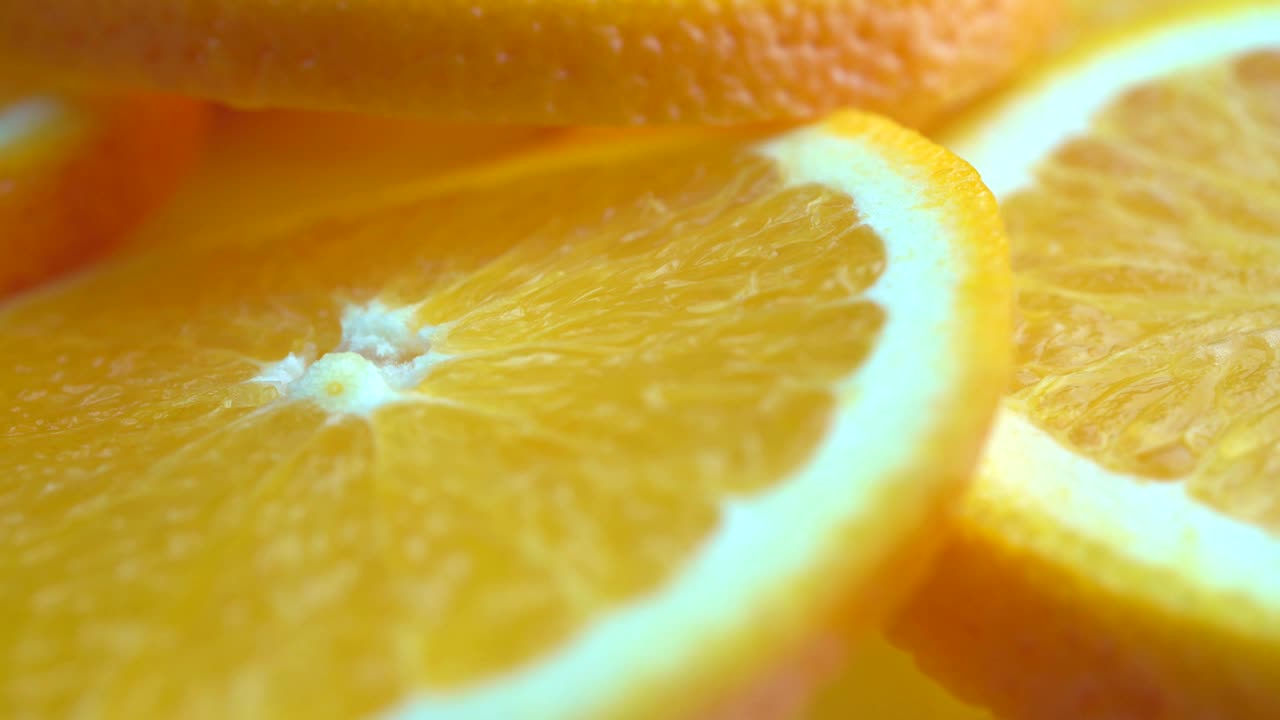 macro rotation video shooting of slice orange fruit .Close up flesh of orange.
