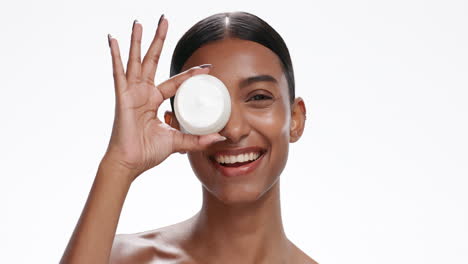 Face-of-Indian-woman-with-jar-of-cream