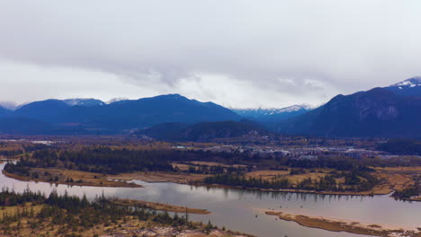 Scenic-aerial-drone-view-of-a-picturesque-mountain-wilderness-on-a-cloudy,-autumn-day