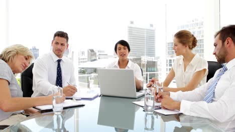 Happy-business-team-applauding-their-colleague