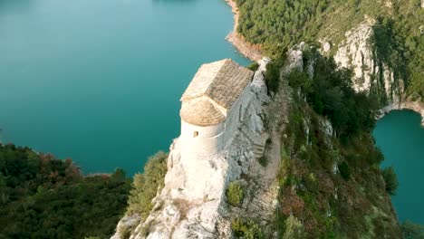 a small house structure on the rock peak in catalonia spain