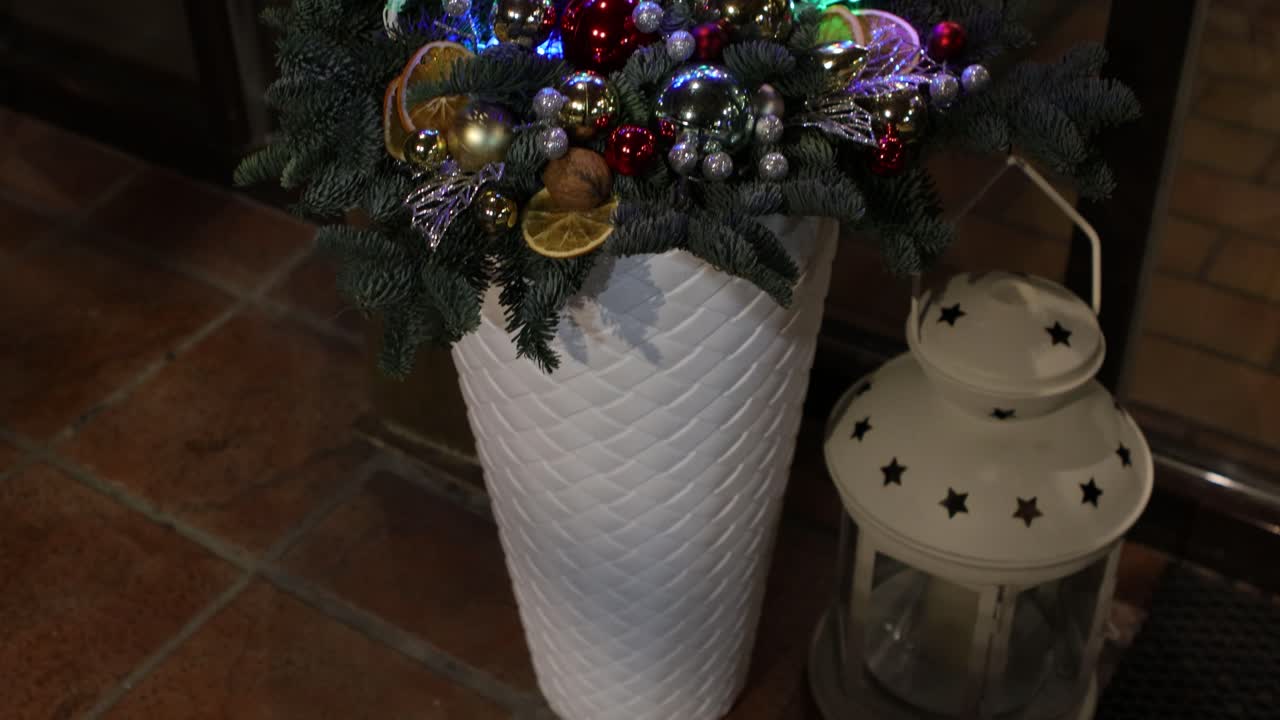 Angel shaped Christmas outside decor next to a house