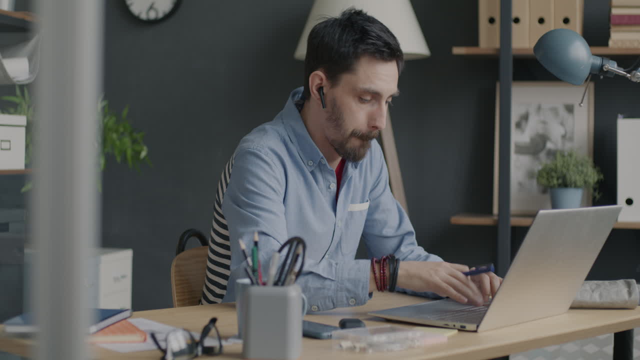 Man Working from Home on Laptop