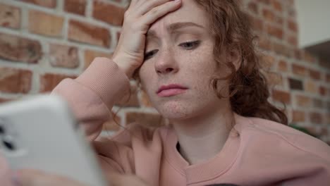 close up low angle video of young caucasian woman using mobile phone