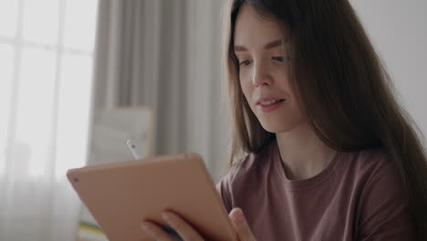 teenage girl using a digital tablet