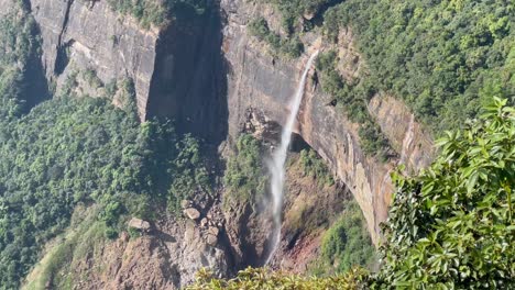 nohkalikai falls, plunge waterfall at the edge of cherrapunji plateau on a sunny summer day in meghalaya, india