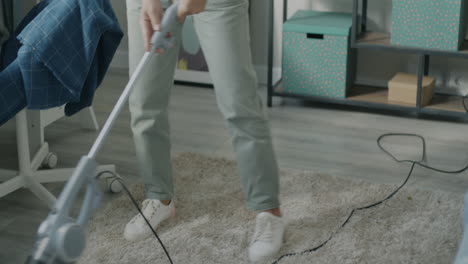 woman vacuuming in a modern home