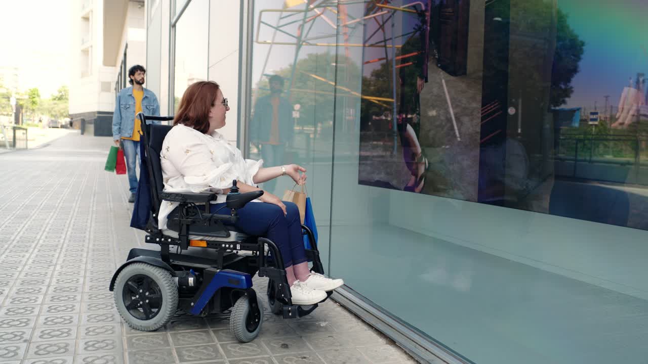 Woman in wheelchair shopping