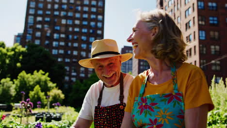 elderly couple gardening in a community garden