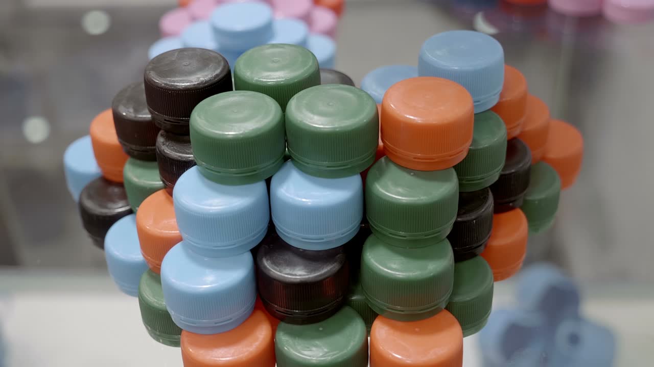 Rows of different colors new plastic caps for jars, bottles, vials
