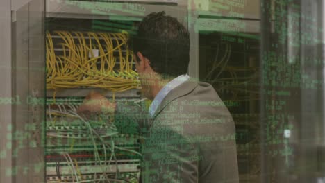 animation of data processing over back view of caucasian man checking servers