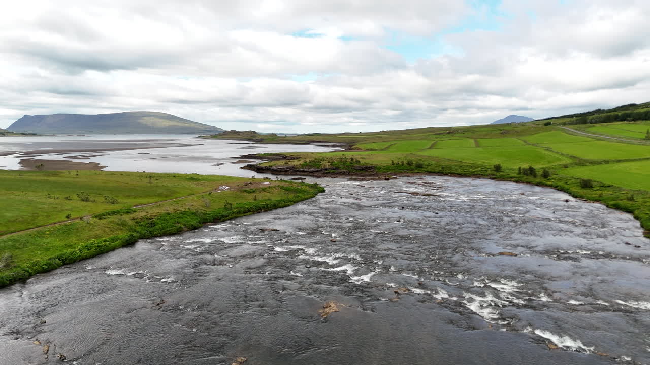 Aerial view of Hvalfjörður fjord in Vesturland Iceland, showing calm waters, surrounding mountains, and expansive Icelandic landscape from above