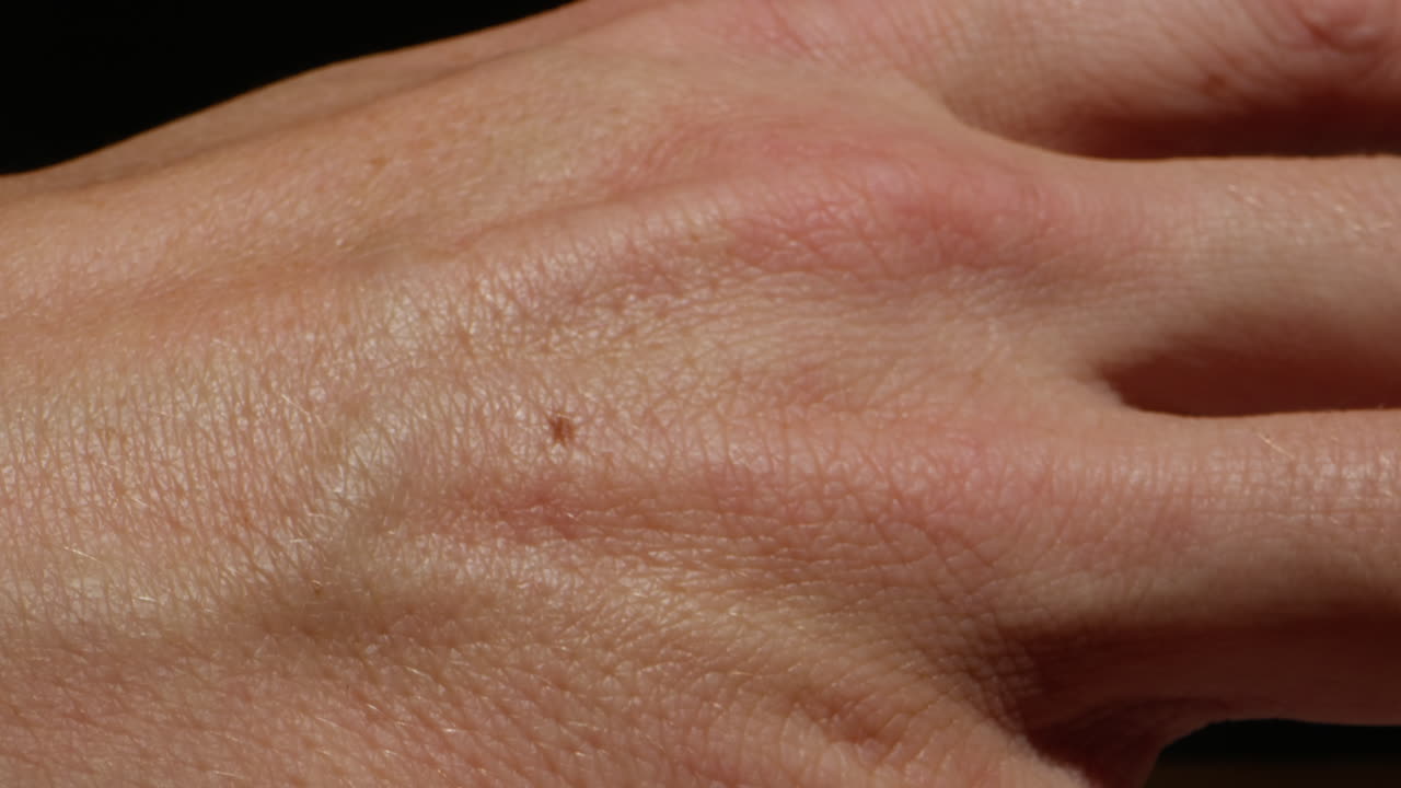 Close-up of man hand skin texture. Macro Detailed human skin, lines on hand palm.