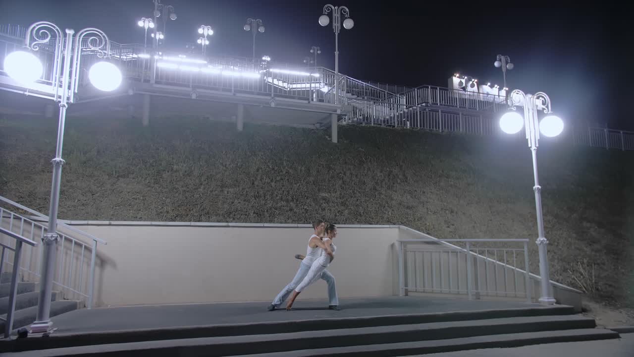 Couple Dancing at Night on Steps