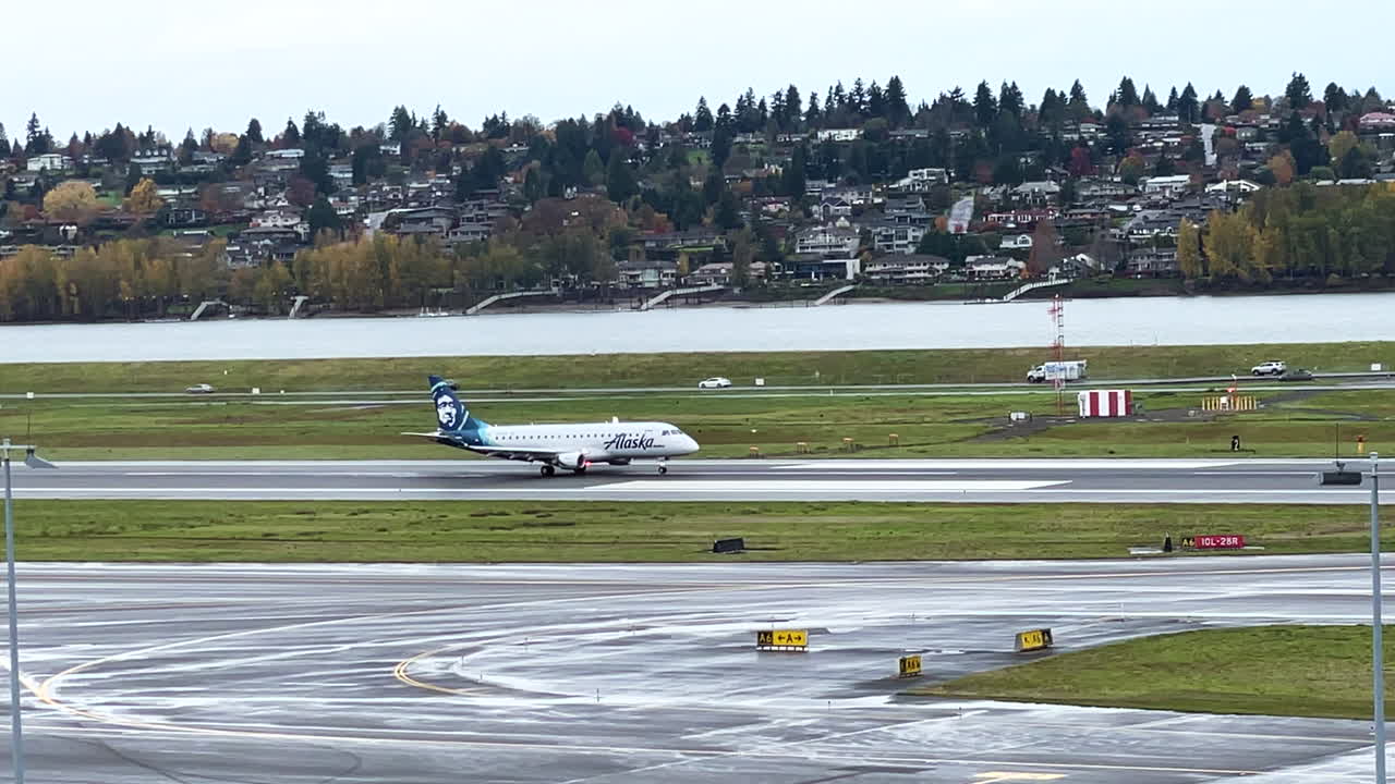 Commercial passenger airplane taking off from International Portland Airport, handheld view