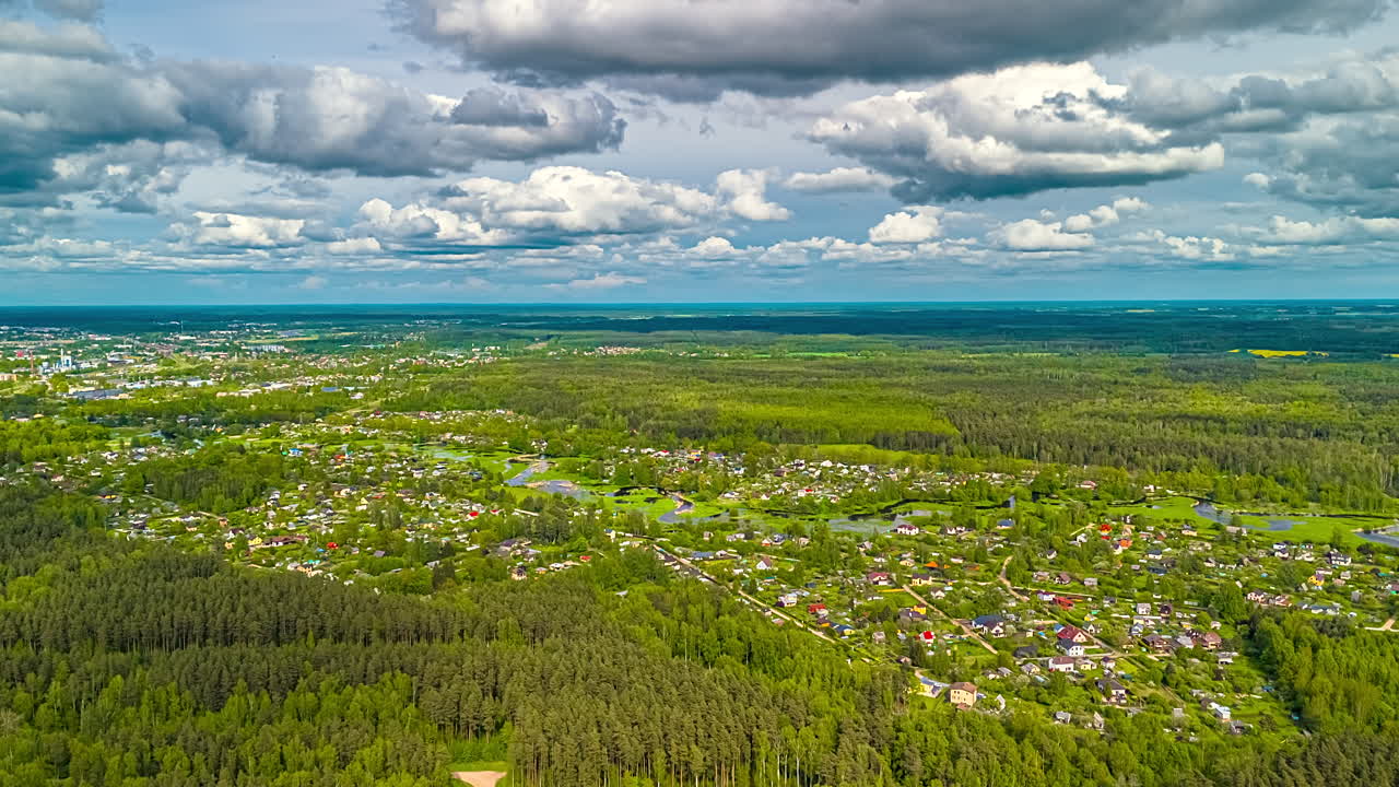 Cloudscape Rolling Over Countryside Neighbourhood Settled In Dense Nature. Timelapse