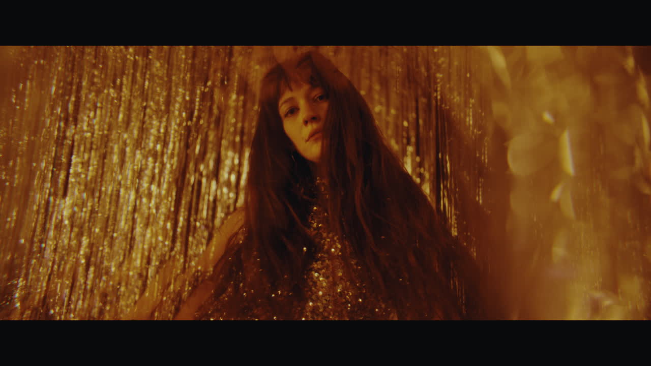 Woman in a Golden Sequin Dress