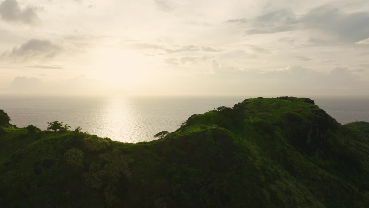 Tropical valley with hills under soft light and open sky