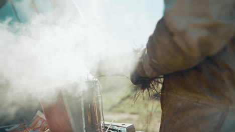 an unrecognizable male beekeeper working