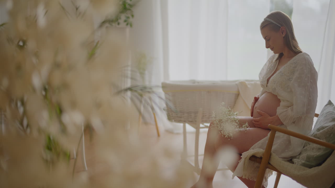 Pregnancy Close-Up: Pregnant Woman Stroking Belly