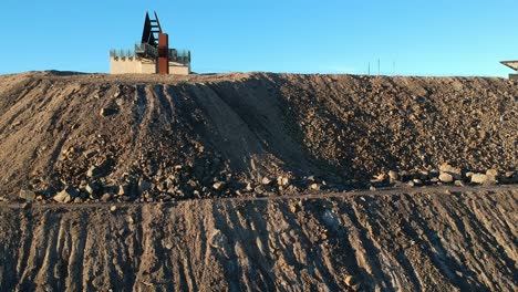 a huge pile of dirt and rocks form the line of lode