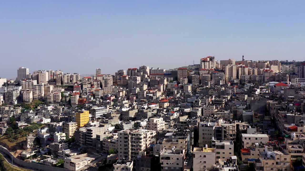 Densely Packed Cityscape with Numerous Buildings Under a Clear Sky
