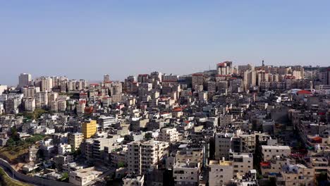 densely packed cityscape with numerous buildings under a clear sky