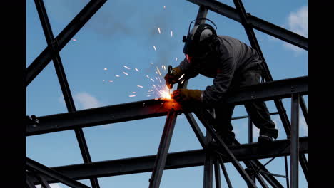 construction worker welding steel beams