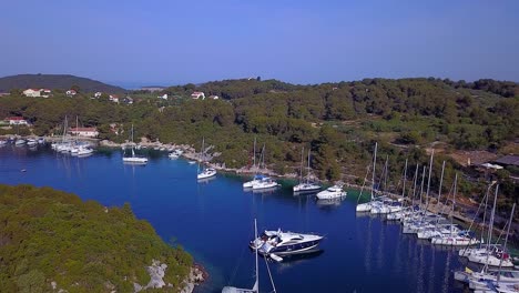 Flying-above-the-vivid-blue-water-inlet-full-of-all-sorts-of-motor-cruisers-and-sailing-craft