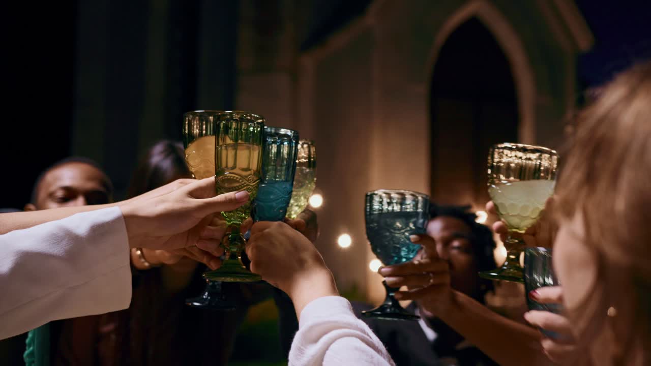 Group toasting at an evening event