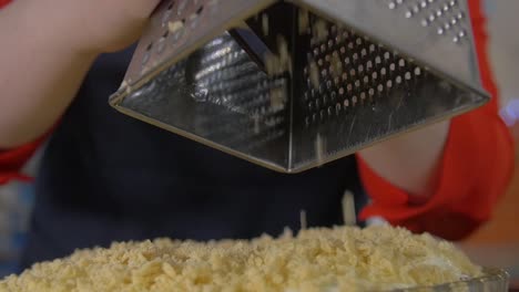 grating topping on a dessert