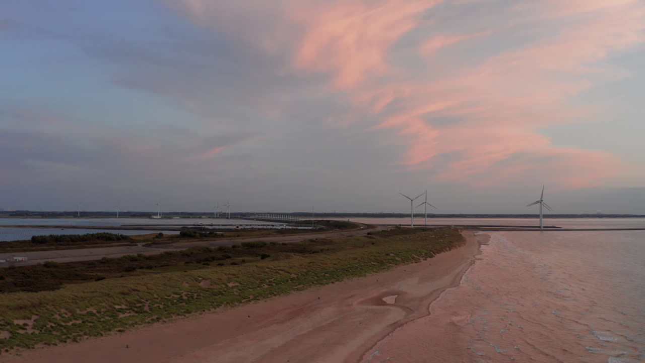 The beach of the island Neeltje Jans, the Netherlands during sunset in summer. Aerial shot