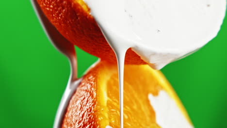 orange slices with milk pouring