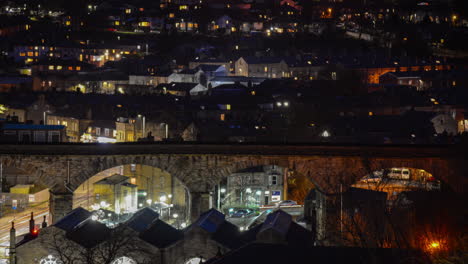 Yorkshire-train-bridge-at-night,-this-time-lapse-includes-town-traffic,-trains-and-with-steam-train