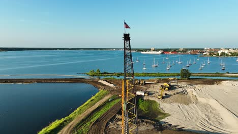 american flag waving on a crane