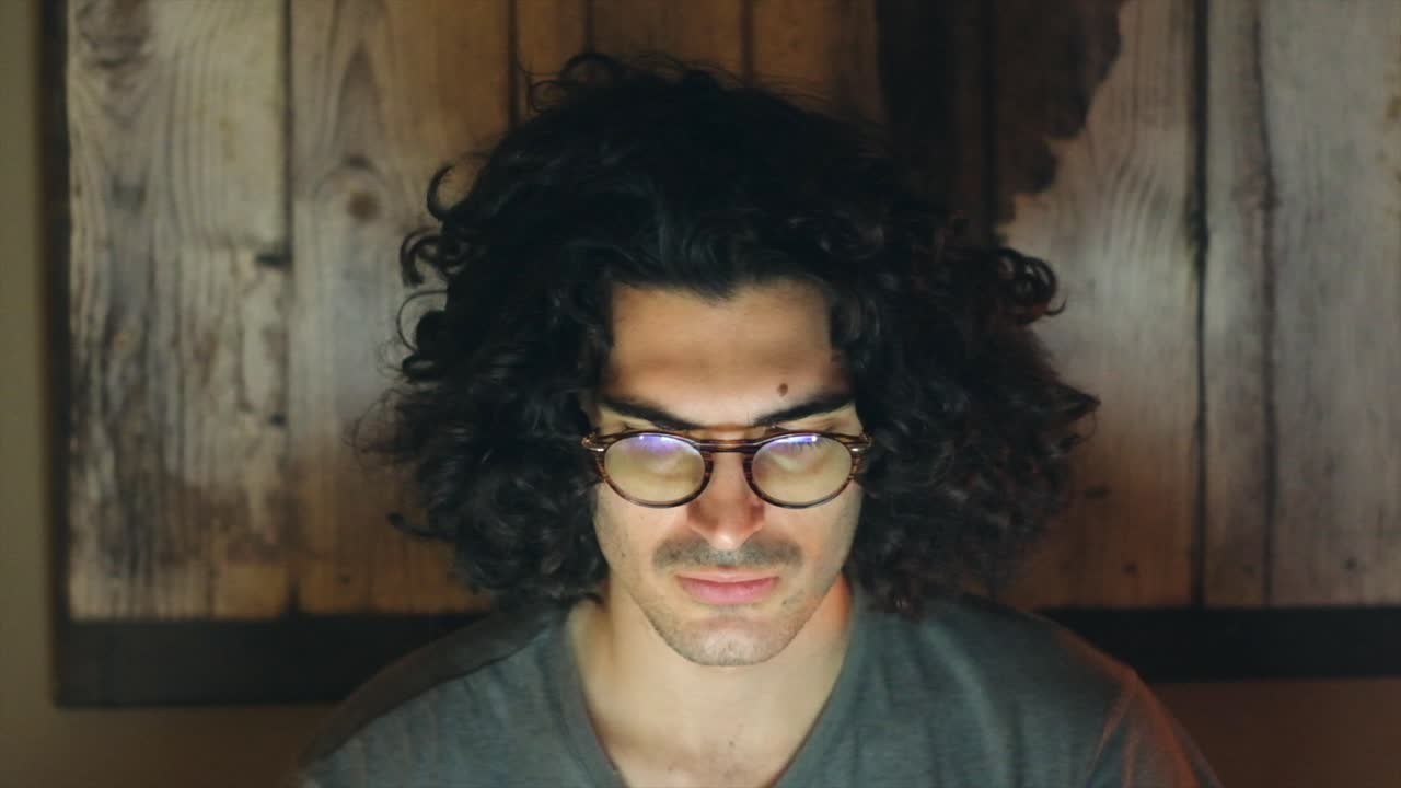 Man working on IT project in dark room