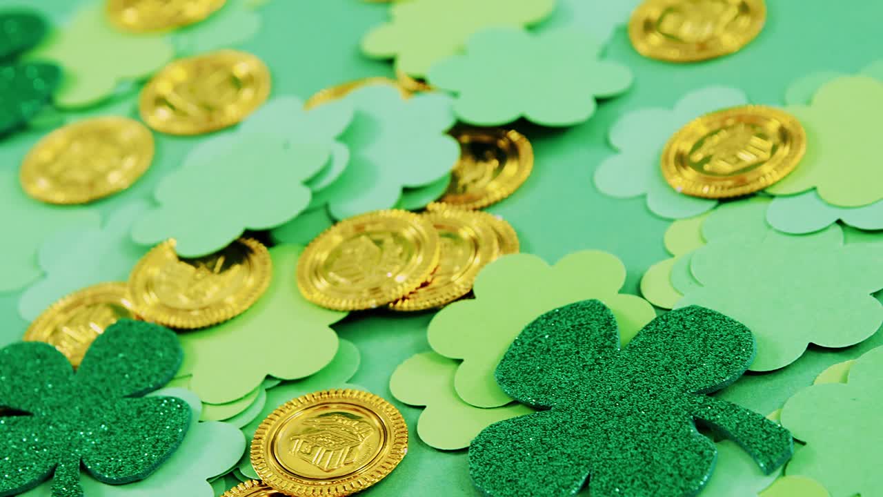 Green shamrocks and leprechauns gold on green background for st patricks