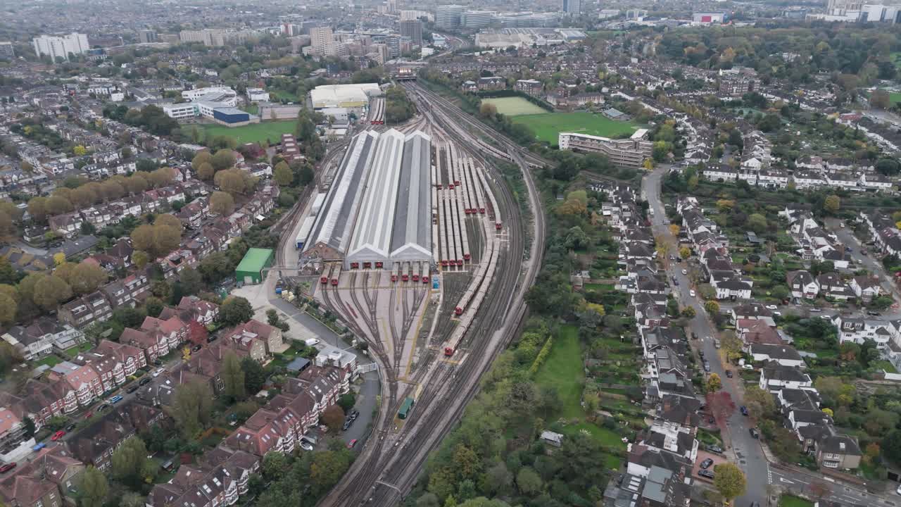 Aerial orbital view of Ealing Common Train Depot, highlighting the storage and organization of underground trains within an urban area in London